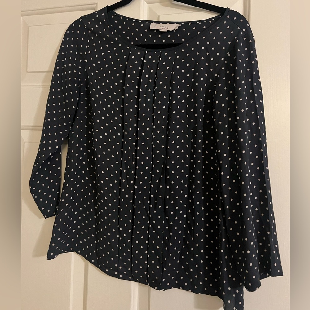 Polka dot blouse.